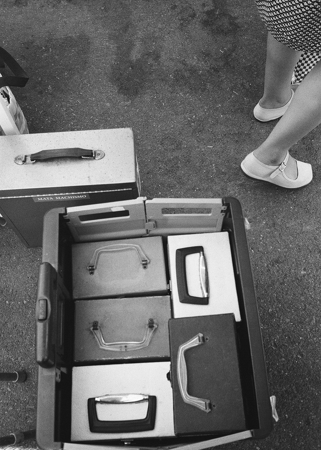 black and white photo of vinyl record boxes in a cart.